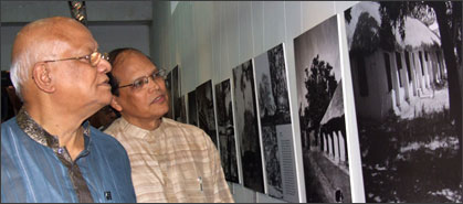 Honorable Finance Minister and Dr. Atiur Rahman watching together the photograph of Tagore exhibited in the Alias Francis.